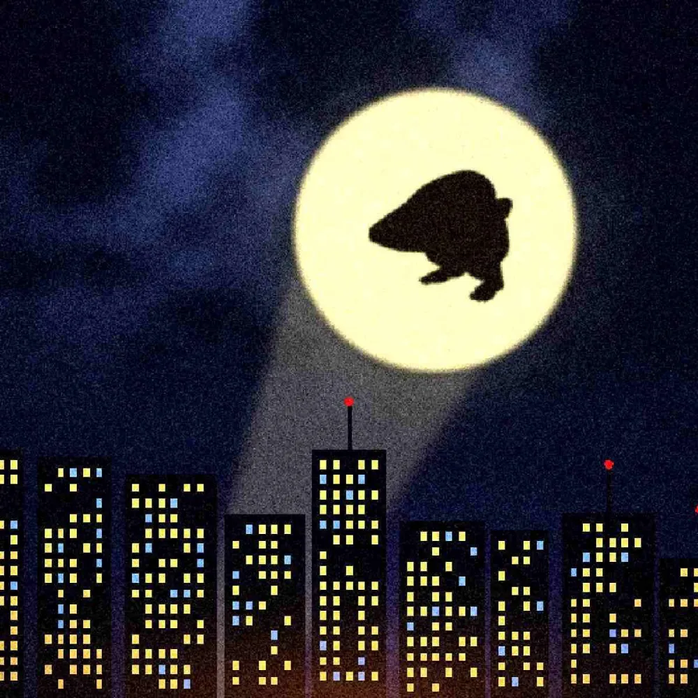 The creature's silhouette projected on the clouds over a city